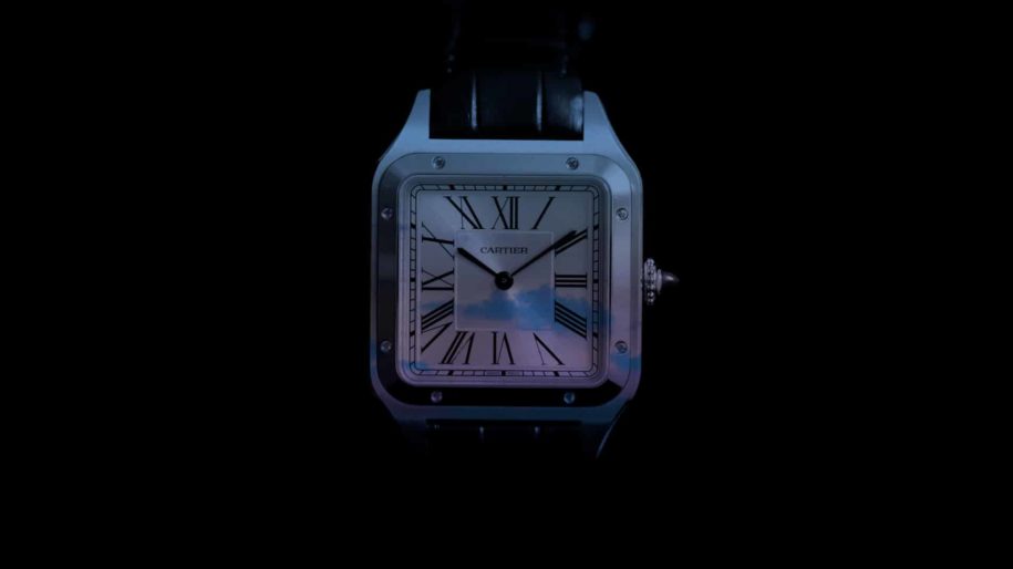 Cartier - The Iconic Age - Mockup of Santos De Cartier Watch with Colorful Clouds