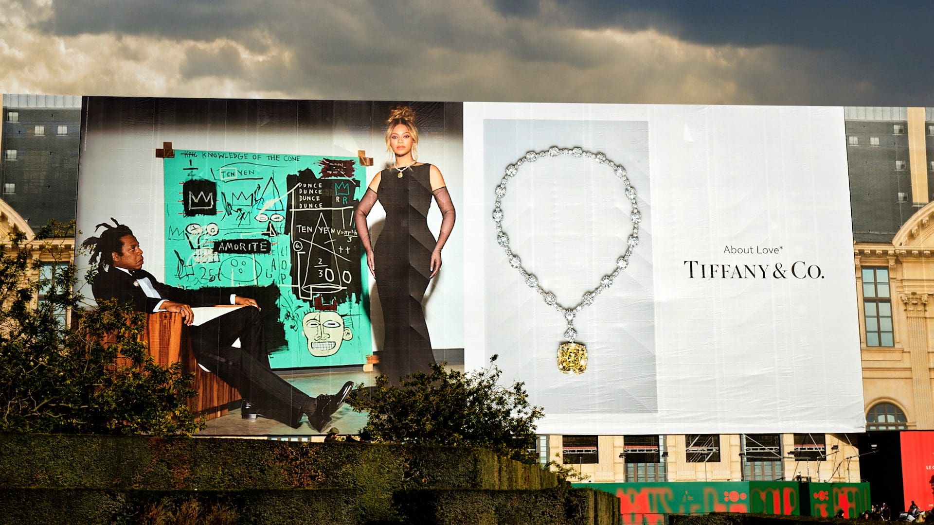 Billboard advertisement featuring a prominent display of Tiffany & Co.'s 'About Love' campaign with images of Jay-Z and Beyoncé alongside an exquisite piece of Tiffany jewelry.