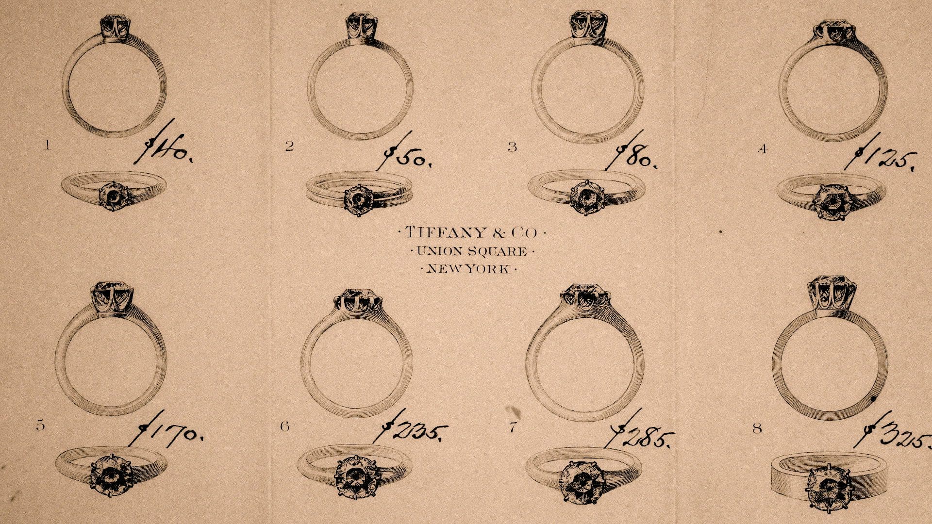 Vintage Tiffany & Co. advertisement showcasing a selection of eight engagement rings with prices, illustrating the classic jewelry styles offered at their Union Square store in New York.