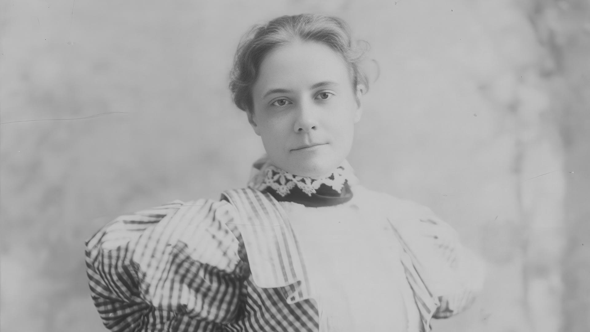 Portrait of Agnes Northrop, Tiffany Studios stained glass designer, circa early 1900s. Cropped and upscaled by RIOT. Image via Wikimedia Commons.