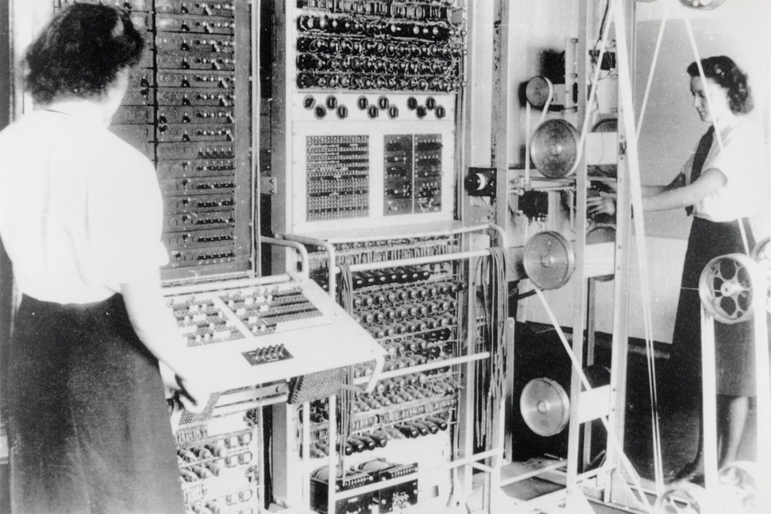 Two women operating the Colossus Machine at Bletchley Park during World War II.